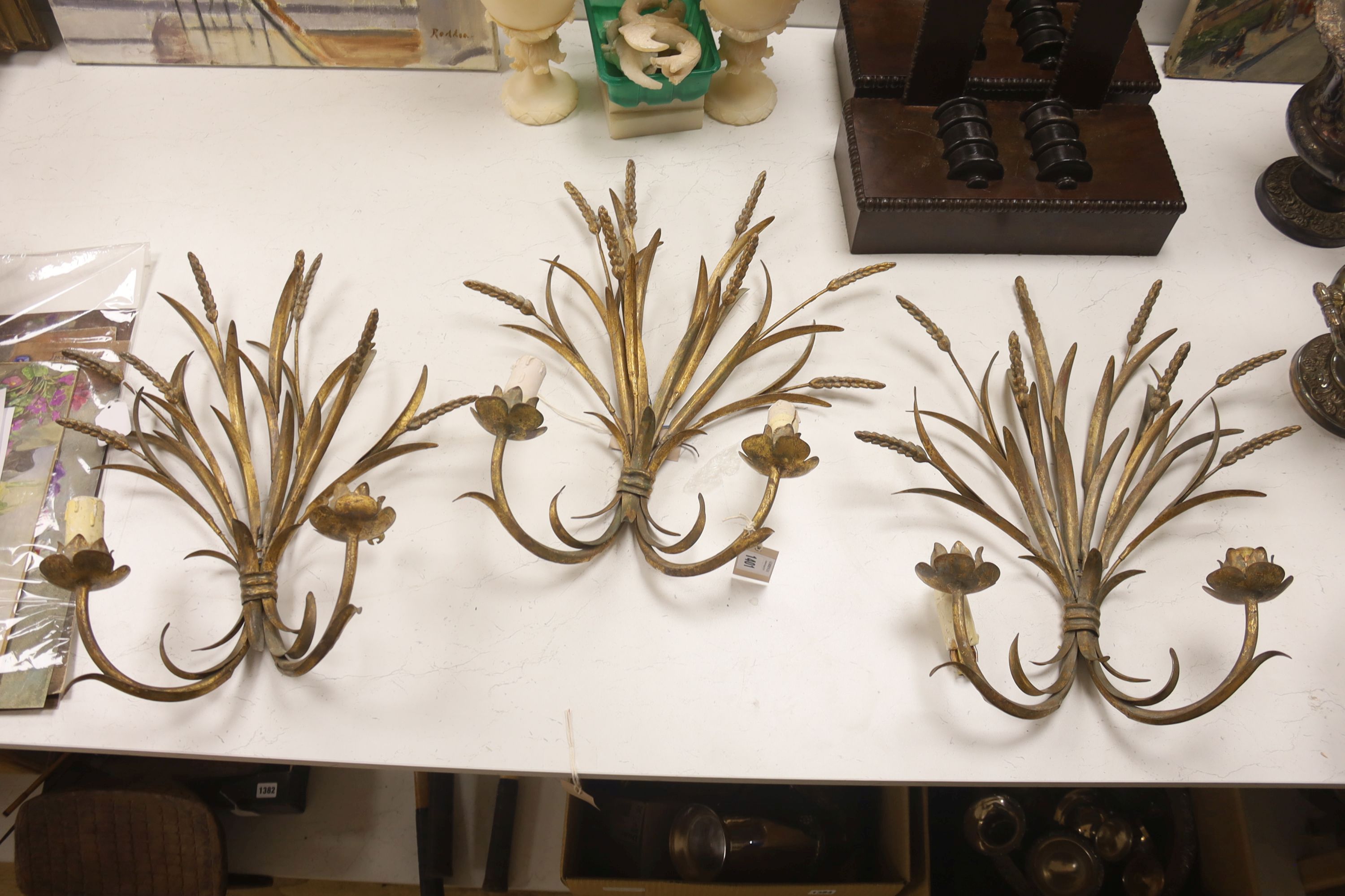Three gilt metal wheatsheaf two branch wall lights, height 50cm
